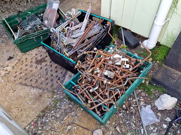 Crates of brass and copper offcuts sorted by grade