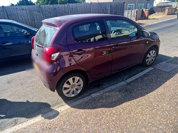 Small hatchback collected for scrap from a residential street