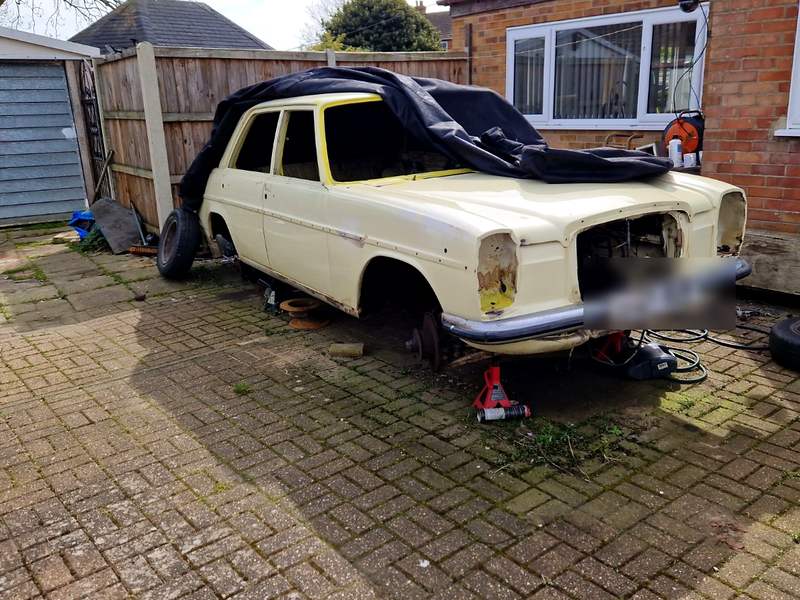 Unfinished project car cleared from a driveway