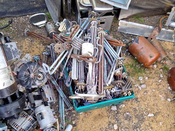 Sorted electric motors alongside brass and copper pipework