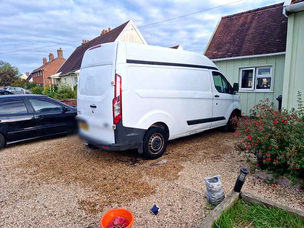 Panel van collected for scrap from a customer's driveway
