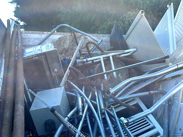 Scrap metal and old furniture loaded into the tipper at the end of the day