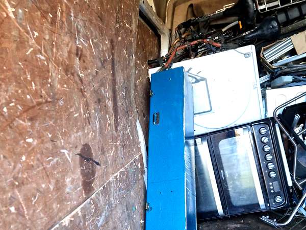 Van loaded with catering equipment and appliances collected for recycling